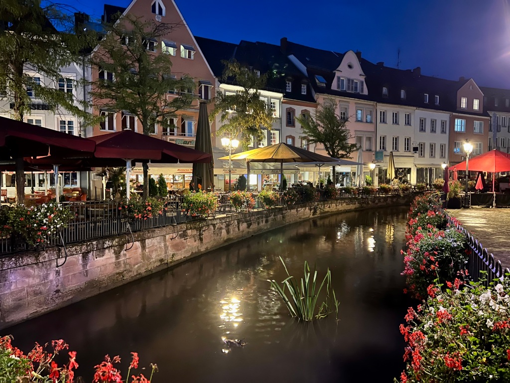 Night picture of Saarburg, with canal and restaurants