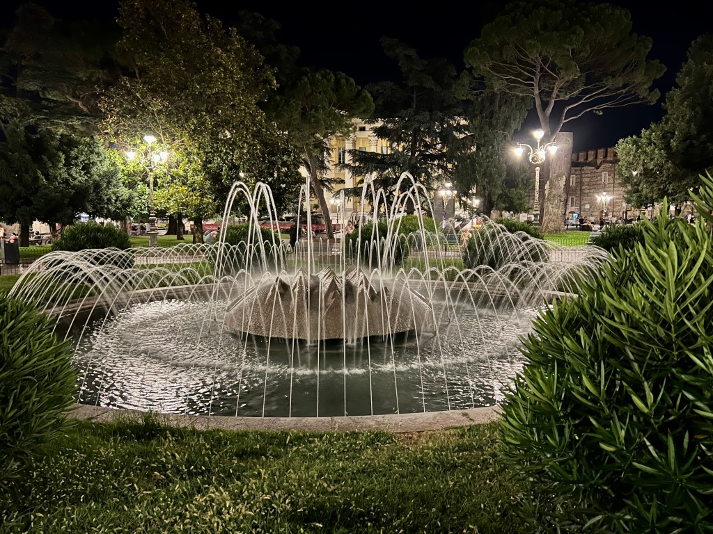 Night photo of fountain in Arena area of Verona.