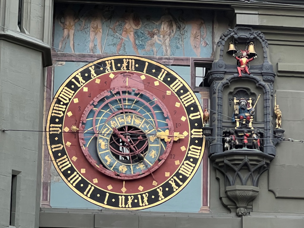 close-up of the astrological details in one of the clock faces