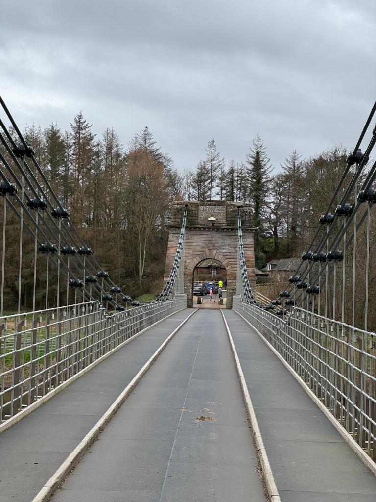 A view across the bridge, showing the single land for cars
